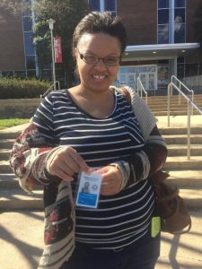 Raynelle with her Washington County Public School employee badge on her first day working in the kitchen at E. Russell Hicks Middle School. 