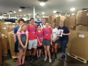 photo Cathys iPhone Summer Learn and Lead students warehouse 300x225 - Students Learn How Donations Turn into Job Training