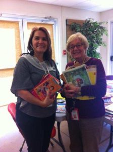 Annette Jamison and Susan Loeffler with new books for their classrooms!